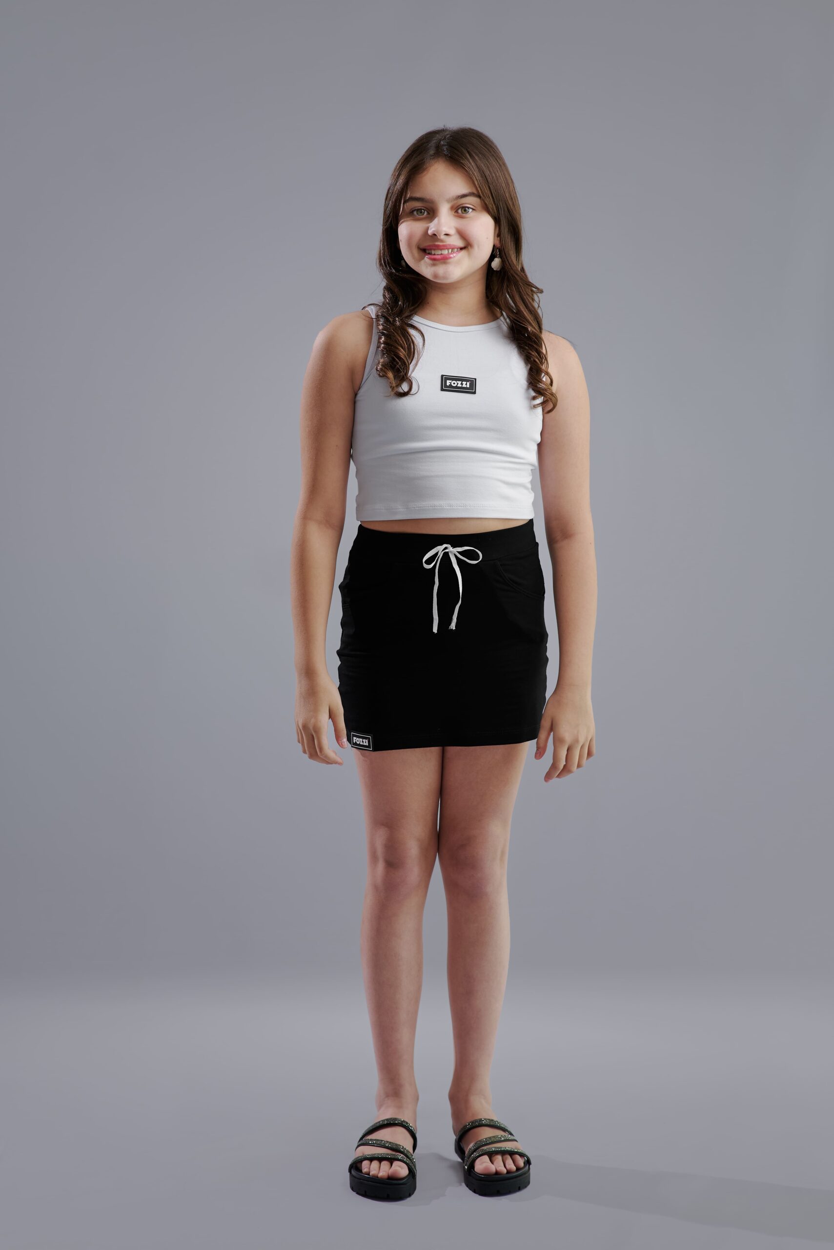 CONJUNTO NICOLLY  (conjunto teen regata cropped + mini saia preto)
